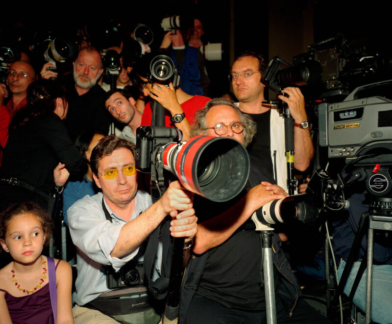 FRANCE. Paris. Photographers at the ready at Versace show. 2001.
